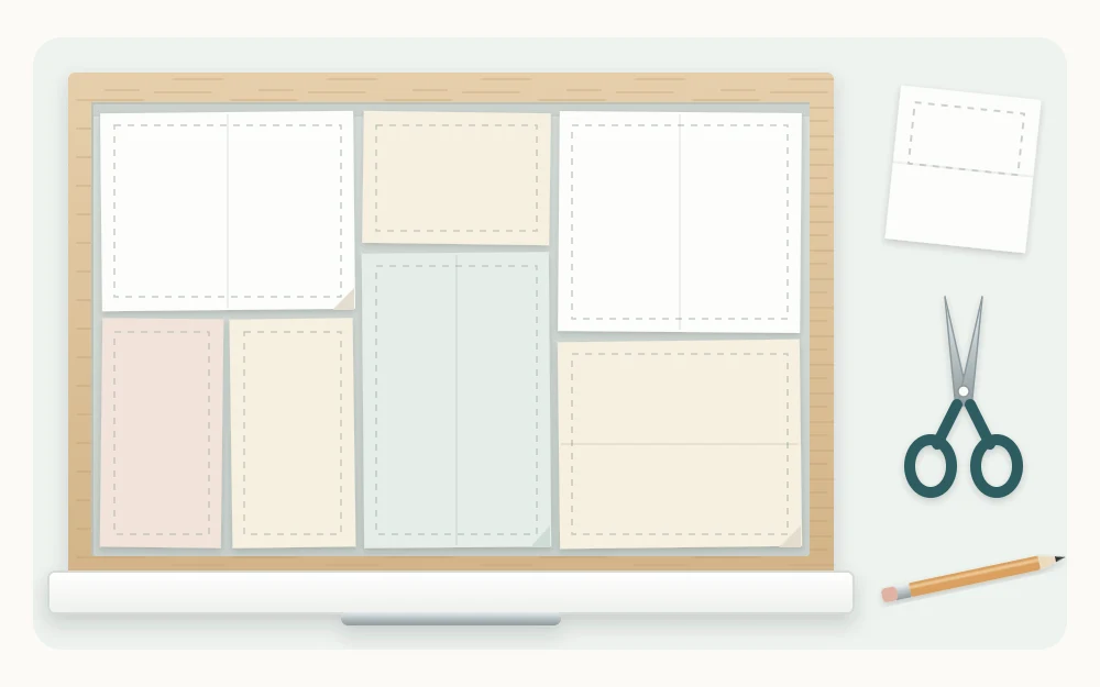 Top view of a drawer with plain paper rectangles of different sizes laid inside as templates, covering the floor like a puzzle