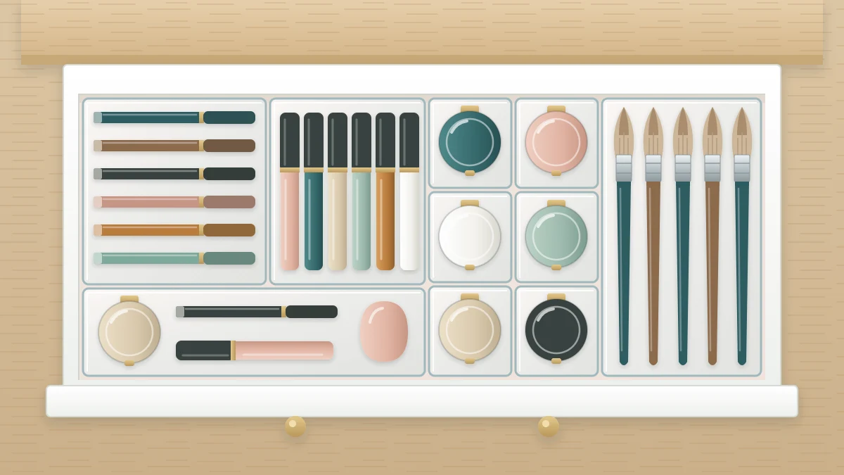 Top view of a shallow drawer with clear dividers holding a row of pencils, a row of slim tubes, round compacts in squares and a lane of brushes