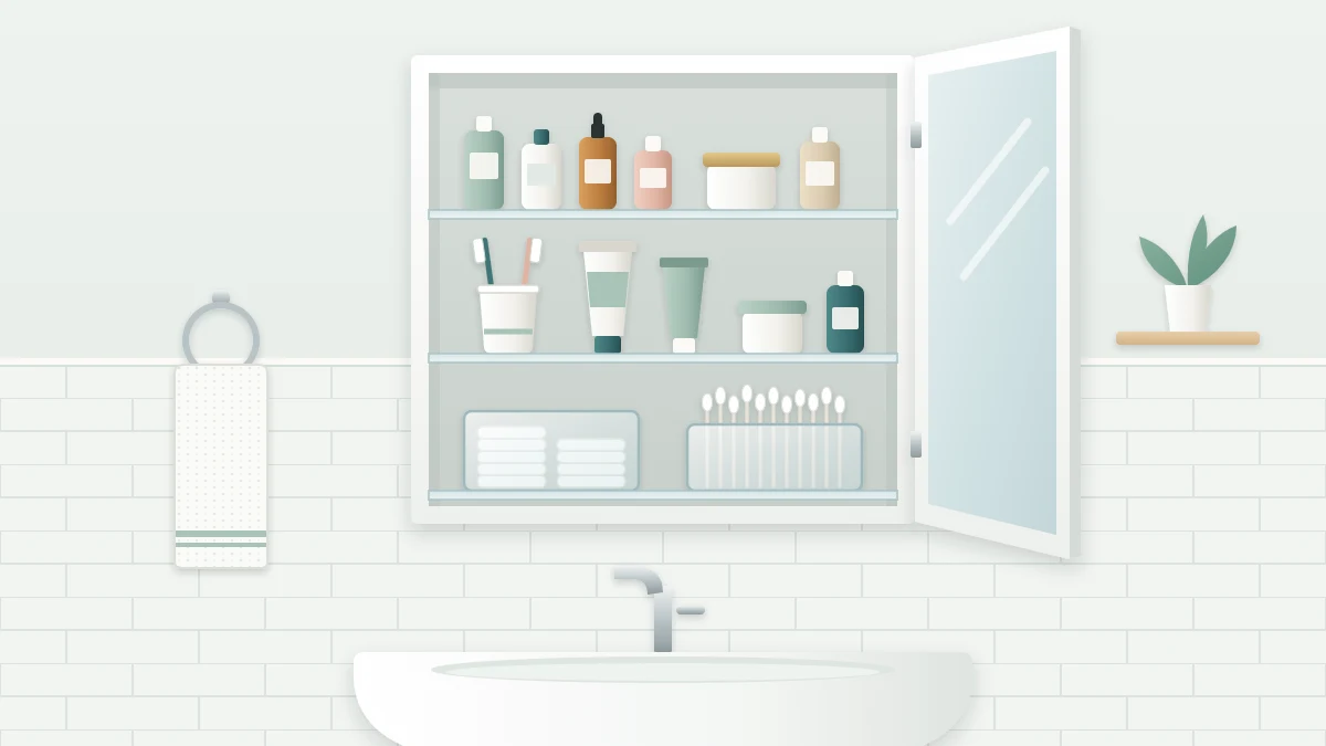 An open mirrored wall cabinet above a sink with three glass shelves holding toothbrushes in a cup, small bottles and two clear bins