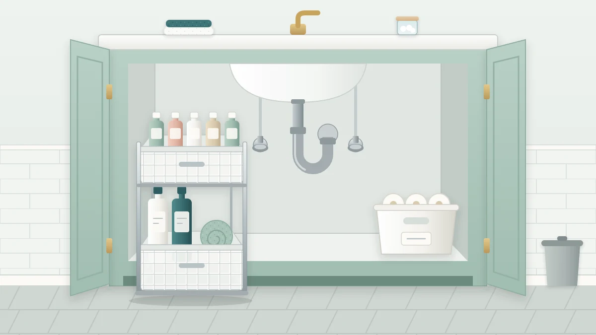A two-tier sliding basket organizer pulled halfway out of an open cabinet, small bottles in the upper basket and taller bottles and cloths below